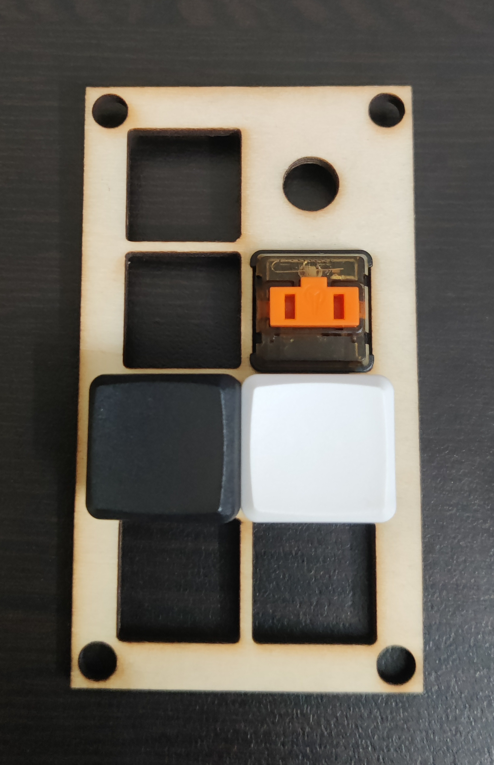 The v0 top plate, showing how there is not enough space between the keys on each row of the macropad.